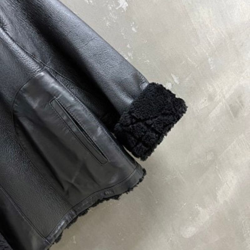 Christian Dior black double-faced leather-effect jacket with faux shearling lining and trim.