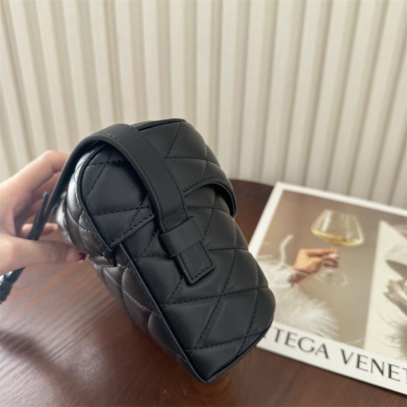 Saint Laurent June Box Bag in black quilted leather.