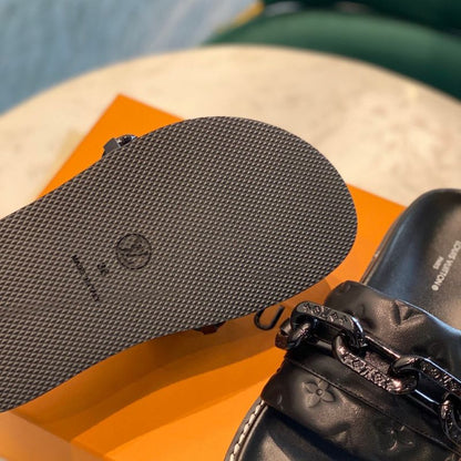 Louis Vuitton LV Sunset Flat Comfort Mule in black.