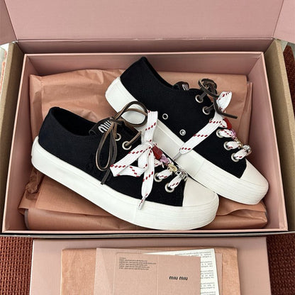 Miu Miu Washed Denim Sneakers.