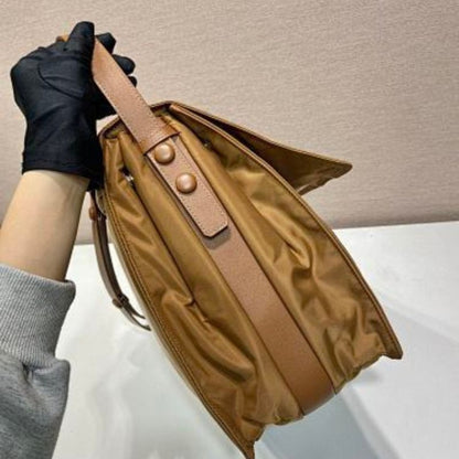 Prada Re-Nylon Large Padded Shoulder Bag in a caramel brown shade.