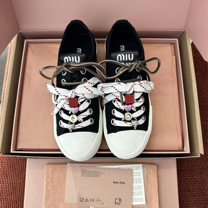 Miu Miu Washed Denim Sneakers.