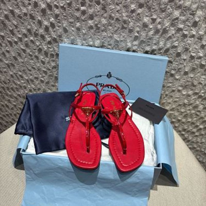 Prada Patent Leather T-Strap Enameled Triangle Logo Sandals.