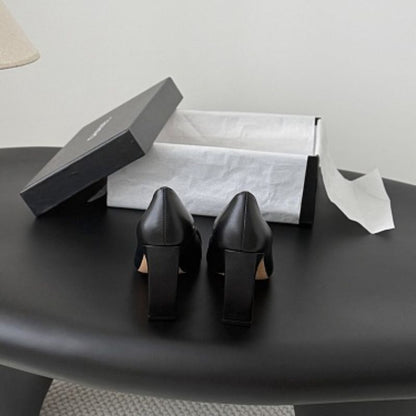 Chanel Interlocking CC Square-Toe Pumps in black (noir).