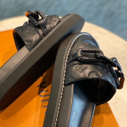 Louis Vuitton LV Sunset Flat Comfort Mule in black.
