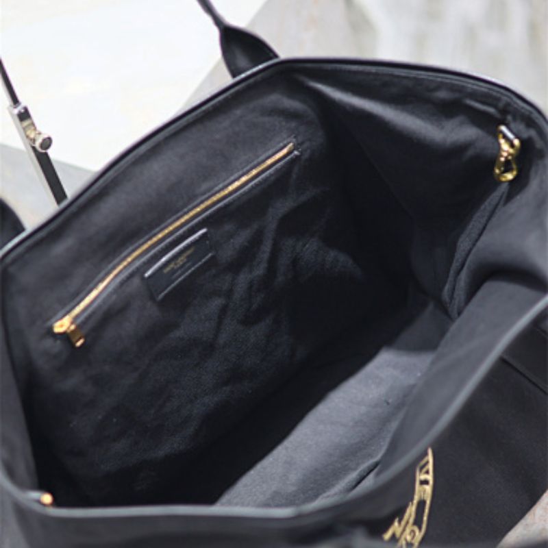 Saint Laurent Rive Gauche Round Logo Tote Bag in black.