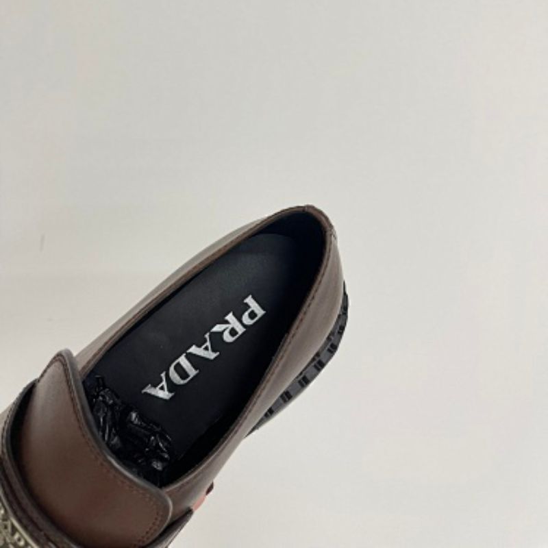 Prada Chocolate Brushed Leather Loafers in a deep ebony dark brown ("Ebano") colorway.