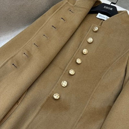 Christian Dior camel coat with gold-tone logo buttons.