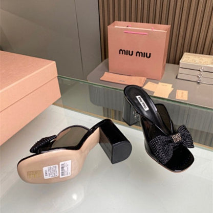 Miu Miu black patent-leather mules or sandals,