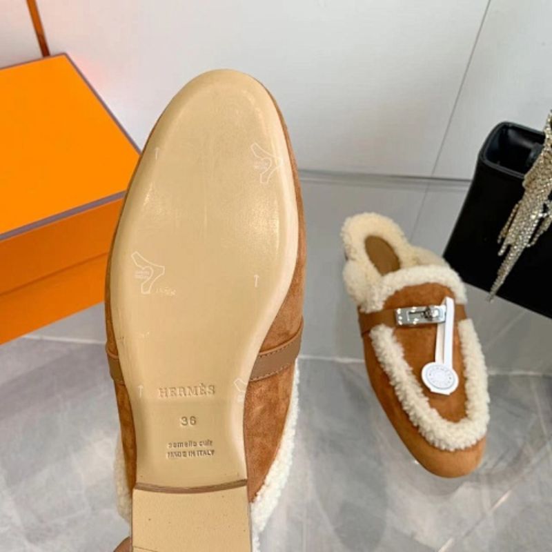 Hermès Carlotta Mules in the Gold (tan) shearling variation.