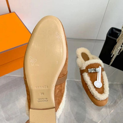 Hermès Carlotta Mules in the Gold (tan) shearling variation.