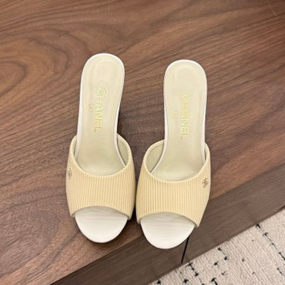 Chanel Ribbed Knit Open-Toe Mules in beige.