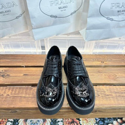 Prada Levitate Brushed Leather Brogues in classic black ("Nero").