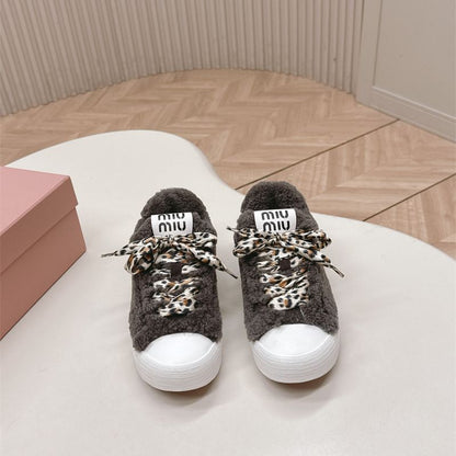 Miu Miu Shearling Fur Sneakers.