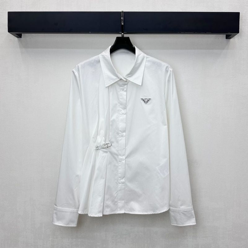 Prada poplin shirt with a pleated panel and safety pin detail.