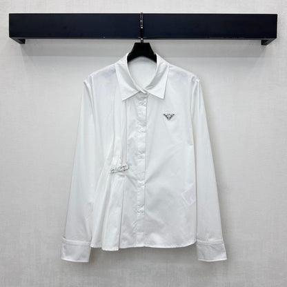 Prada poplin shirt with a pleated panel and safety pin detail.