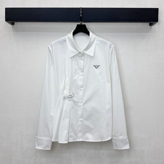 Prada poplin shirt with a pleated panel and safety pin detail.