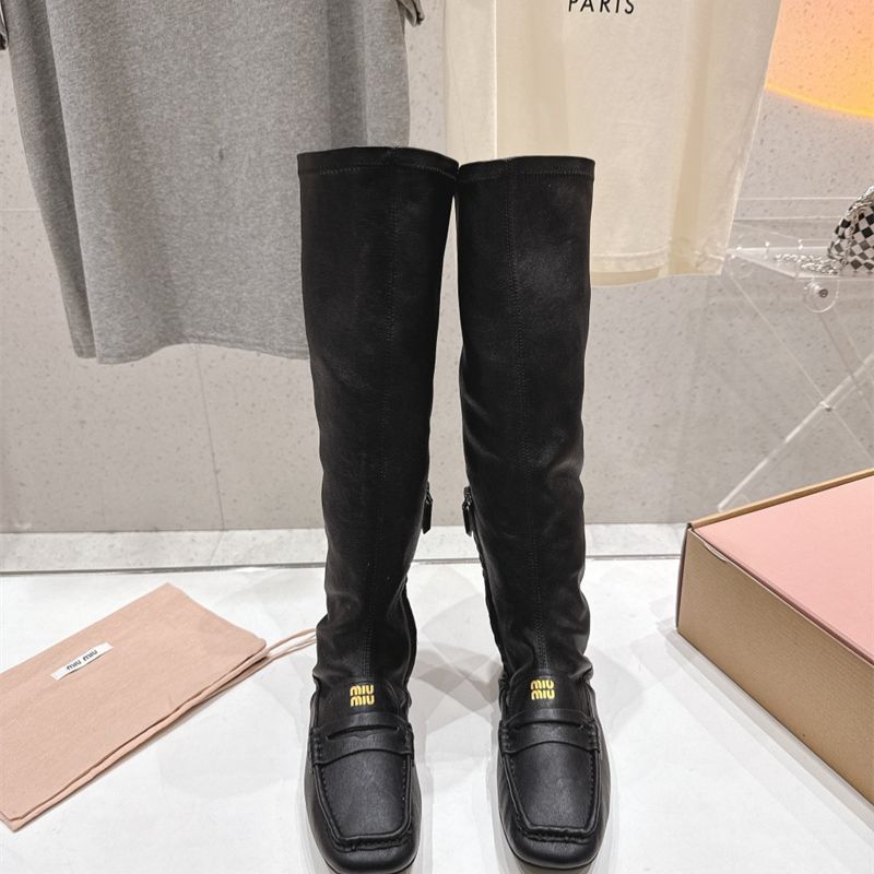 Miu Miu "Loafer" Knee-High Boots.