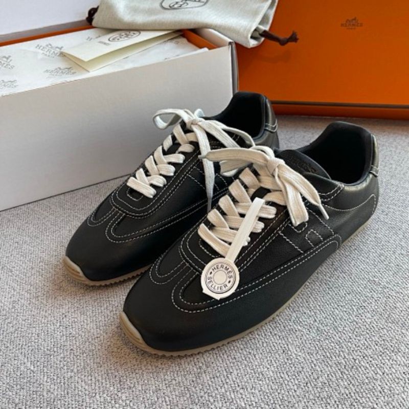 Hermès Master Sneakers in the classic Black/White colorway.