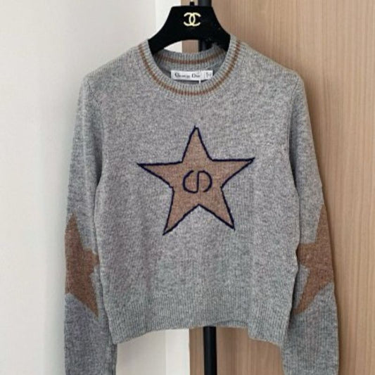 grey Christian Dior cropped sweater with a brown/tan star motif.