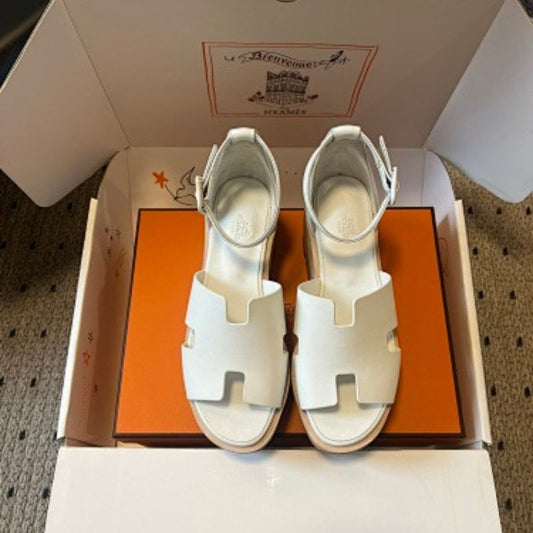 Hermès Eze Sandals in white calfskin.