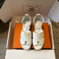 Hermès Eze Sandals in white calfskin.