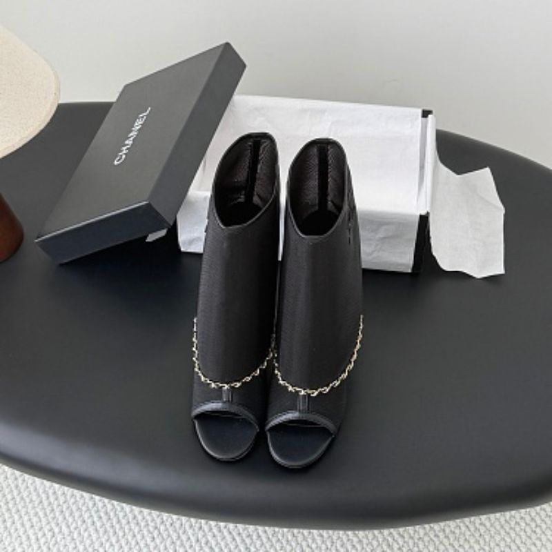 Chanel Mesh Peep-Toe Bootie Sandals in black.