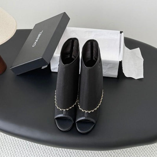 Chanel Mesh Peep-Toe Bootie Sandals in black.