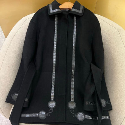 Herm*black wool-blend coat with distinctive faux leather