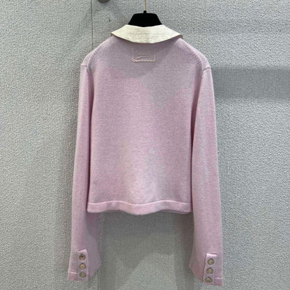 Chanel-style pink knitted cardigan with a white Peter Pan collar