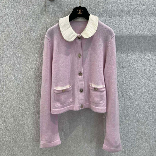 Chanel-style pink knitted cardigan with a white Peter Pan collar
