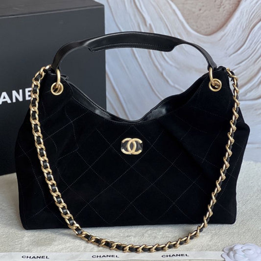 Chanel hobo bag with a gold chain strap and a prominent CC logo closure