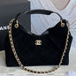 Chanel hobo bag with a gold chain strap and a prominent CC logo closure
