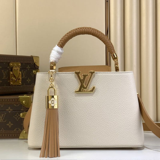 Louis Vuitton Capucines BB handbag in white Taurillon leather with a tassel charm