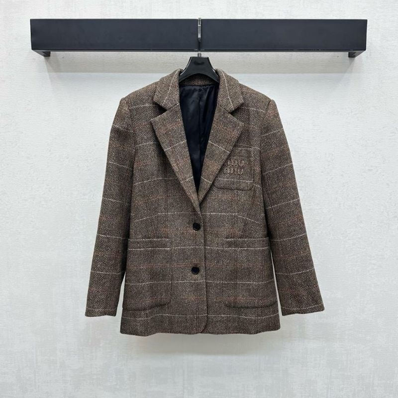 Miu Miu brown tweed blazer.