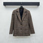 Miu Miu brown tweed blazer.