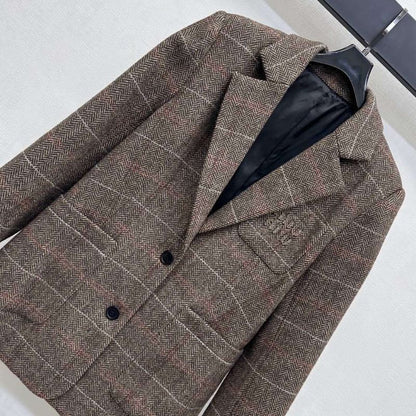 Miu Miu brown tweed blazer.