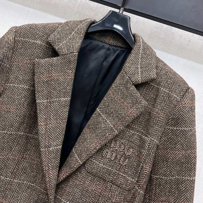 Miu Miu brown tweed blazer.