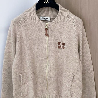 Miu Miu beige knit zip cardigan.
