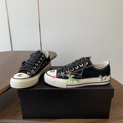 Chanel black canvas low-top sneakers