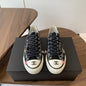 Chanel black canvas low-top sneakers