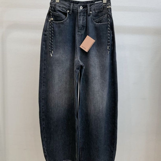 Miu Miu  dark wash, wide-leg denim jeans with a chain detail.