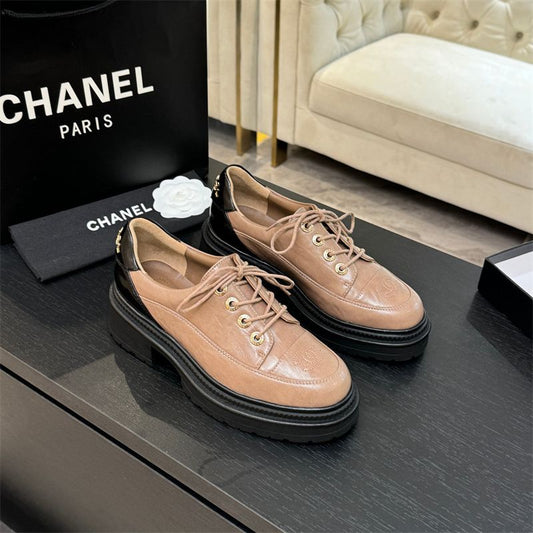 Chanel two-tone platform lace-up shoes.