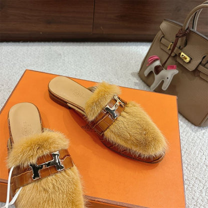 Hermès fuzzy mules.