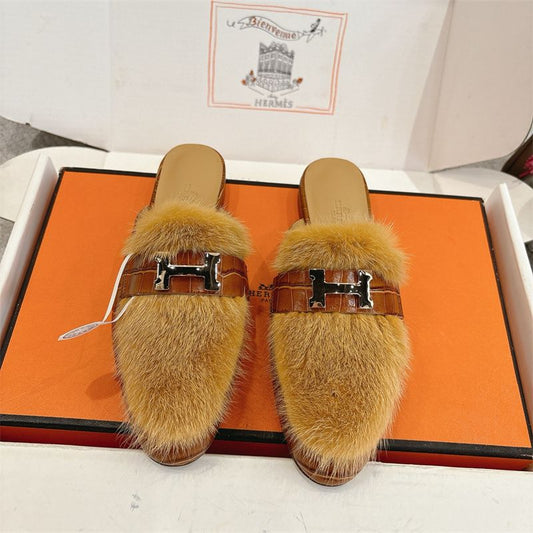 Hermès fuzzy mules.