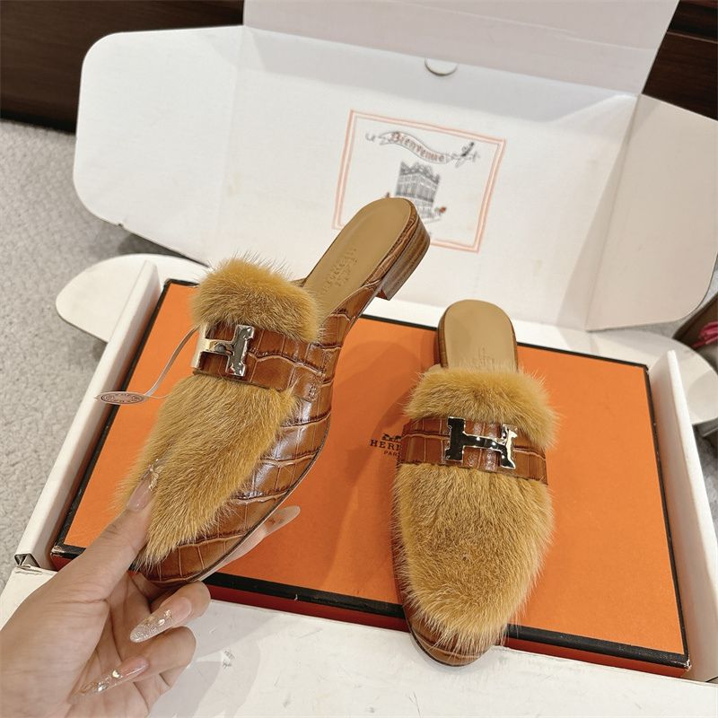Hermès fuzzy mules.