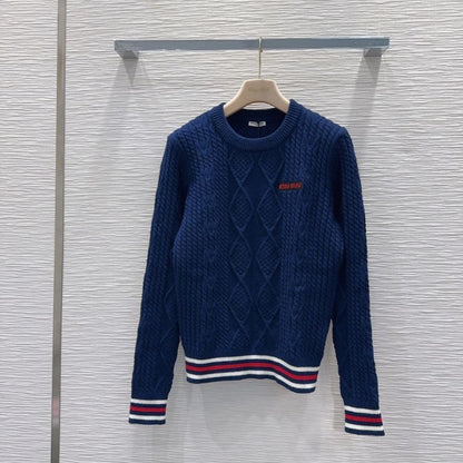 Miu Miu navy blue cable-knit sweater.
