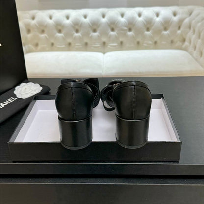 Chanel Mary Jane flats with a bow