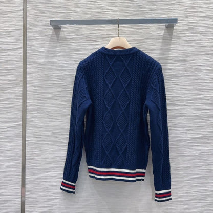Miu Miu navy blue cable-knit sweater.