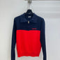 Miu Miu half-zip knit polo sweater.